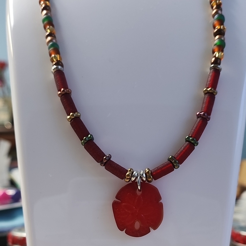 Elegant Red and Green Necklace with Striking Sand Dollar Pendant!